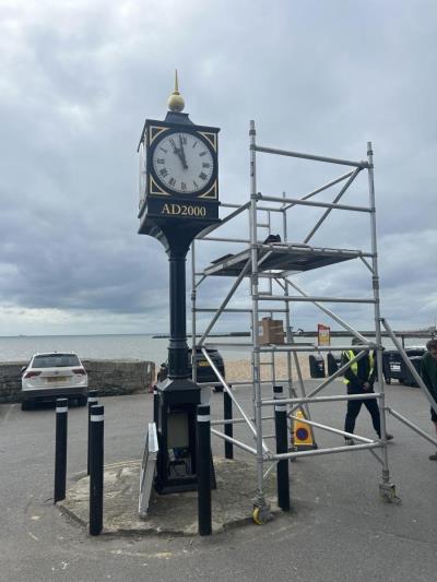 The Millennium Clock at Cobb Gate car park, with a scaffolding tower around it to help with the repairs